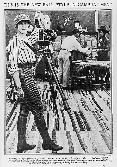 A camera "man" style. New women wore men's knickers, striped shirt, 8 panel cap, gators and oxfords. 