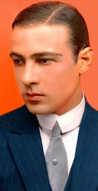 Rudolph Valentino, parted an slicked down hair