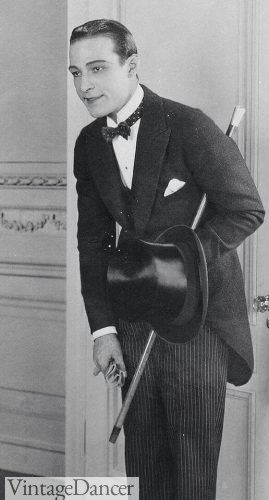 Rudolph Valentino wears morning attire with a black polka dot tie
