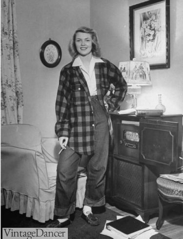 1940s teenager girl wears the boyfriend fashion style with blue jeans and flannel shirt
