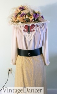 Tan skirt, belt, Blouse and flower hat.