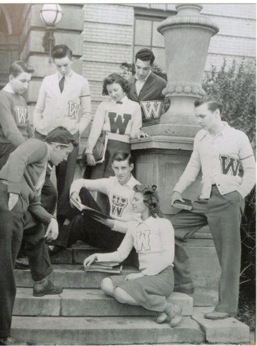 High school students wearing letter cardigans