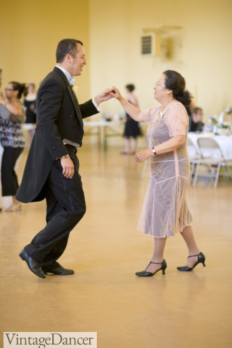 Groom and mother dancing a swing