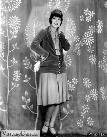 Clara bow wears a velvet blazer over a skirt and blouse at VintageDancer