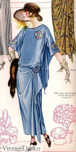Fox fur stole held in hand evening dress