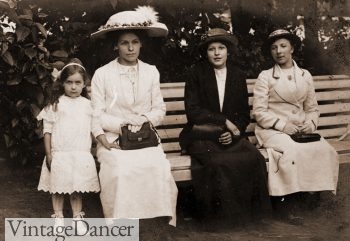 Edwardian ladies holding leather purses
