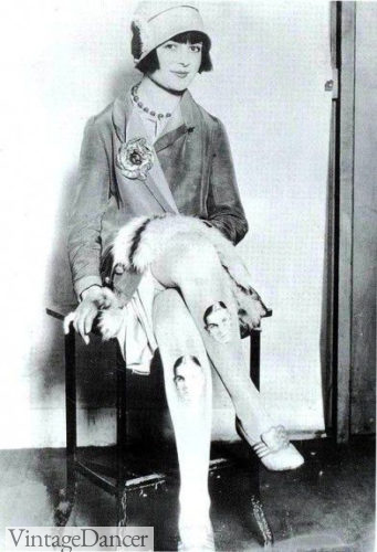 1920s flapper with face painted in her stockings at VintageDancer