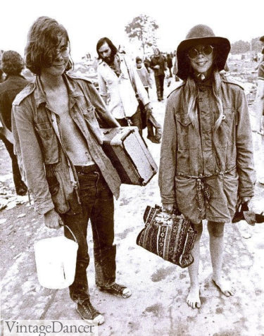 Two young hippies display the oversized and bulky silhouettes of hippie fashion