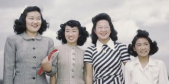 1940s Japanese American woman in internment camps combed and pinned their hair half up and half down varieties.