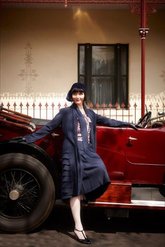 Miss Fisher's blue skirt with matching jacket and striped blouse.