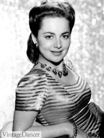Olivia He Havilland adorned in a large statement necklace