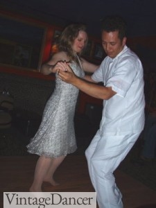 Swing dancing in all white- wide leg trousers and a cotton guayabera