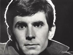 60s mens hairstyles, Anthony Perkins in Five Miles to Midnight Promotional Still - shaggy, slightly overgrown hair that has fallen into his face. The beginning of the rugged chic look