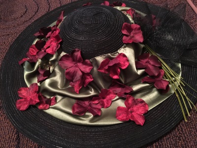 Tea hat decorated with a fabric from a satin shirt and flowers from the Dollar Tree