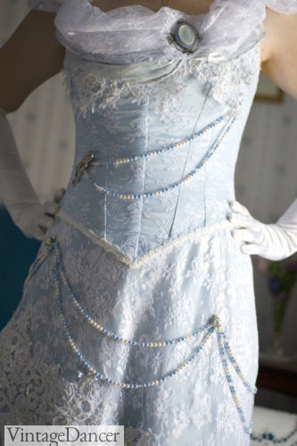My Victorian wedding dress: The front with garlands of blue and white beads attached to the bodice and overskirt.