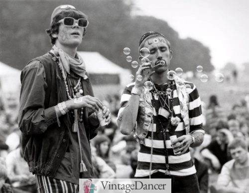 two eccentrically dressed hippie men blowing bubbles in during the 1967 Summer of love at VintageDancer