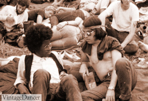 60s mens hairstyles woodstock hippies with long hair and simple clothes at VintageDancer