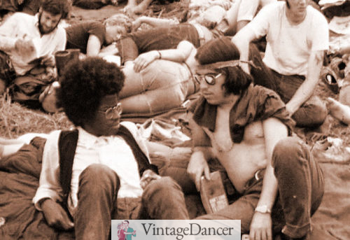 60s mens hairstyles woodstock hippies with long hair and simple clothes at VintageDancer
